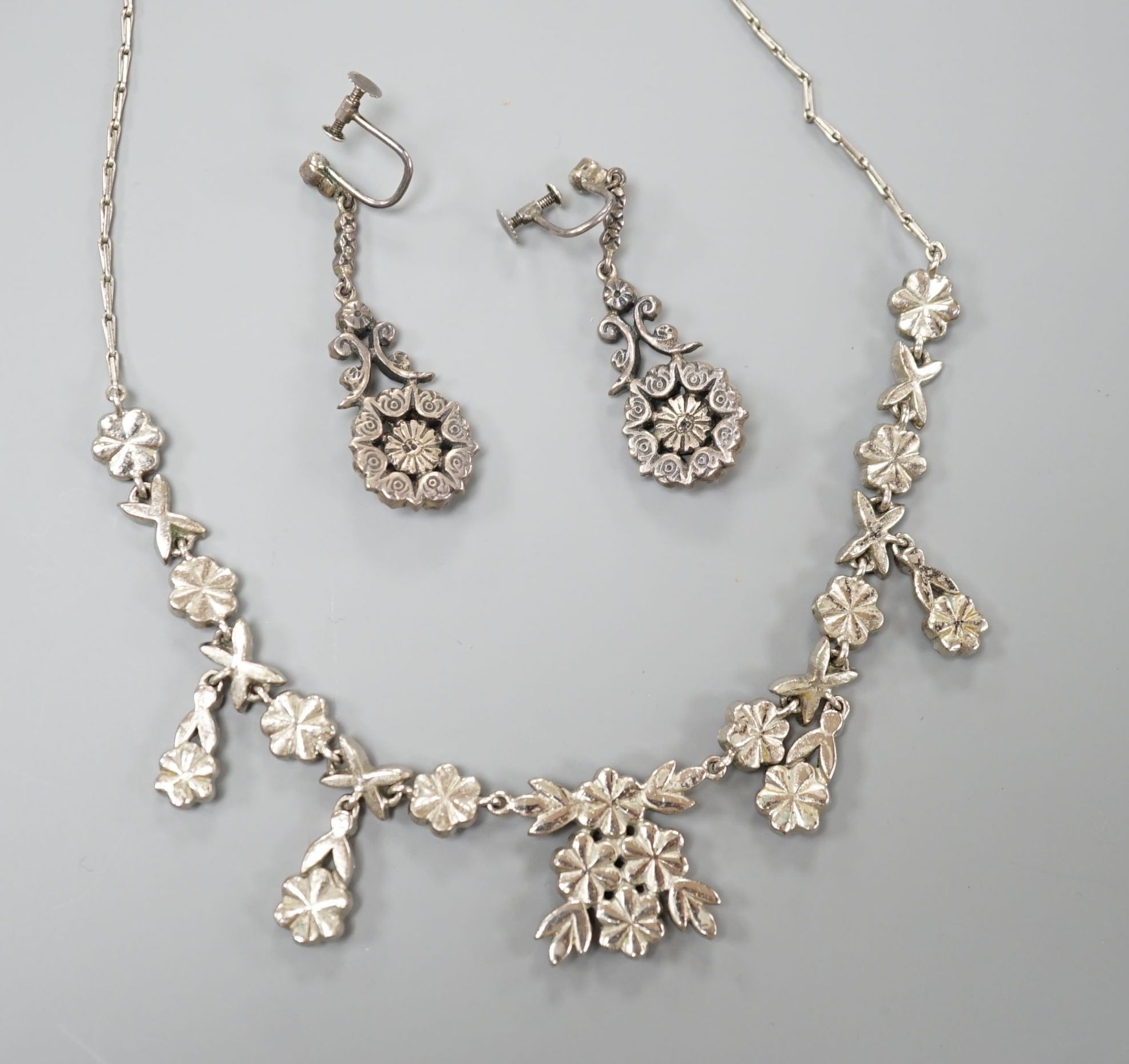 A base metal, marcasite and blue paste set necklace and pair of matching drop earrings, necklace 41cm, earrings 42mm.